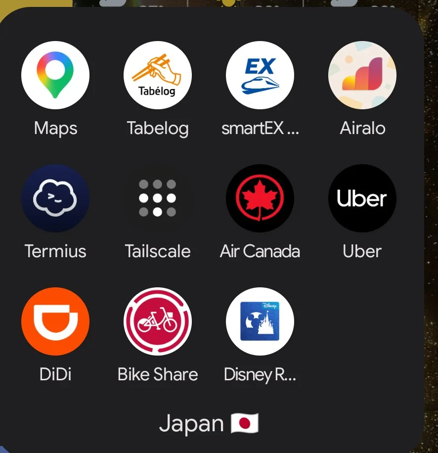 The Japan app folder on a phone: Maps, Tabelog, SmartEX, Airalo, Termius, Tailscale, Air Canada, Uber, DiDi, Bike Share, Disney Resort